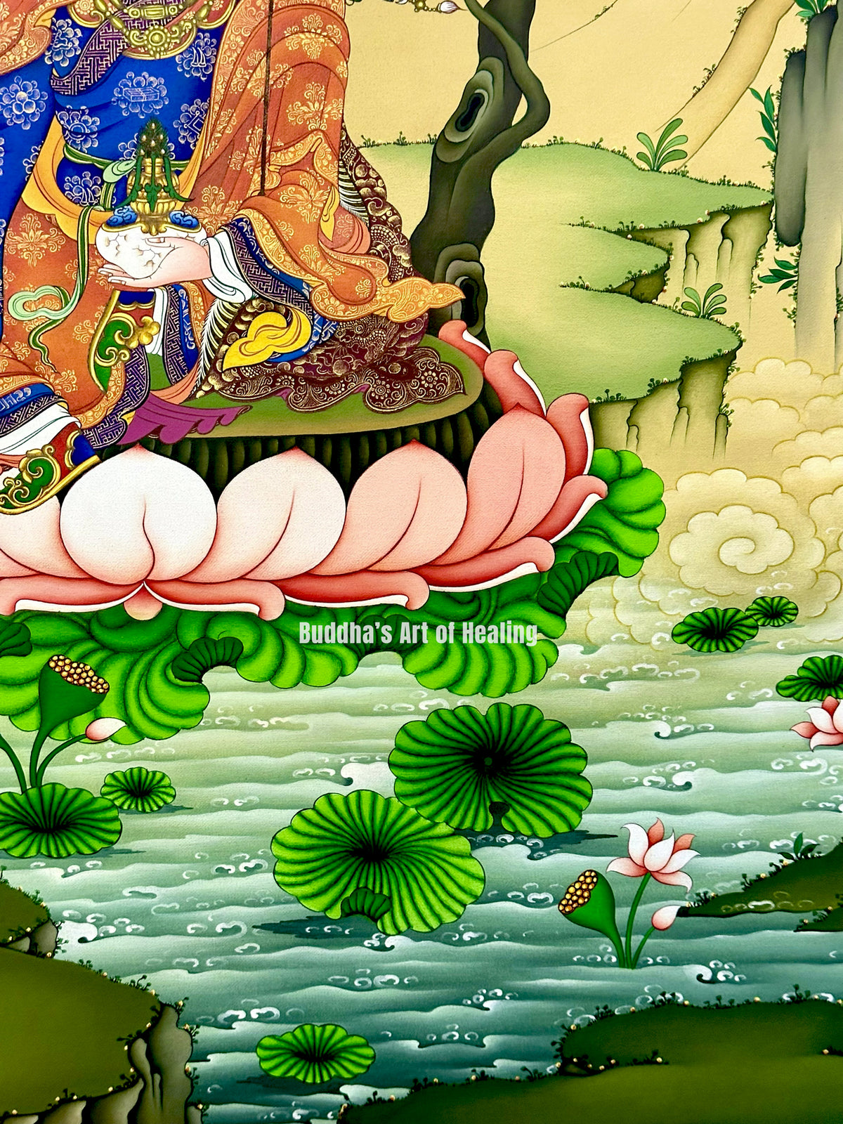 Guru Rinpoche thangka showing a seated figure in ornate blue and orange robes above a lotus pond with pink and white flowers, green lily pads, and a pale yellow sky.