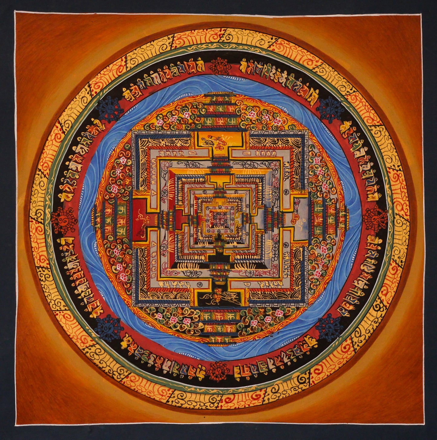 Hand-painted Tibetan Kalachakra mandala featuring traditional Tibetan Buddhist sacred geometry for meditation, spiritual practice, and home altar decor against an orange background.